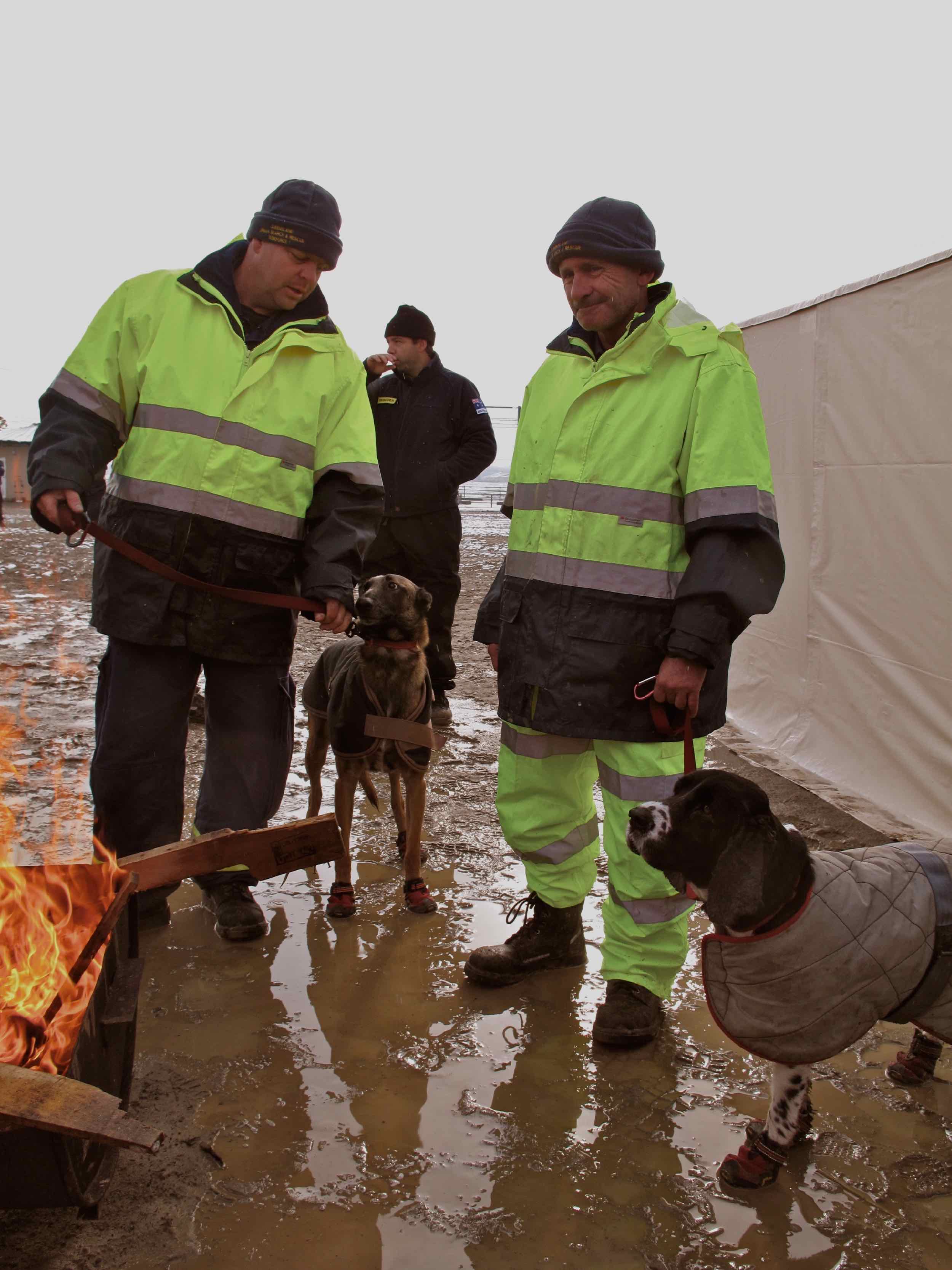  3/15 members of Queensland Search and Rescue Task Force outside Tome City Hall 