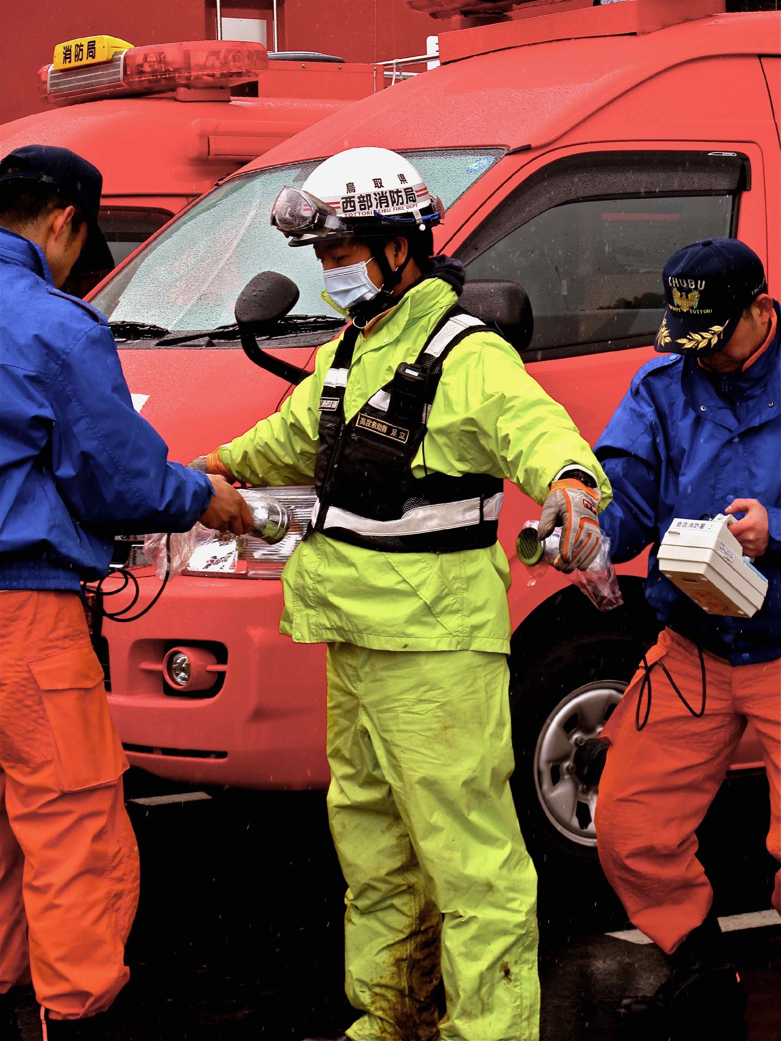  3/15 newly arrived fire brigades checking radiation, staging area for Minami Sanriku operations 
